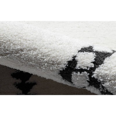 Ivory Rectangular Synthetic Area Rug with Southwestern Motifs