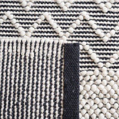 Black and Ivory Hand Tufted Wool 3' x 5' Area Rug