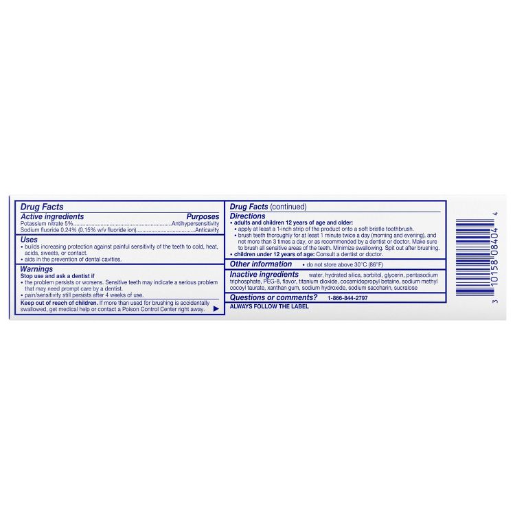 Toothpaste packaging displaying drug facts, active and inactive ingredients, uses, warnings, directions, and a contact number.