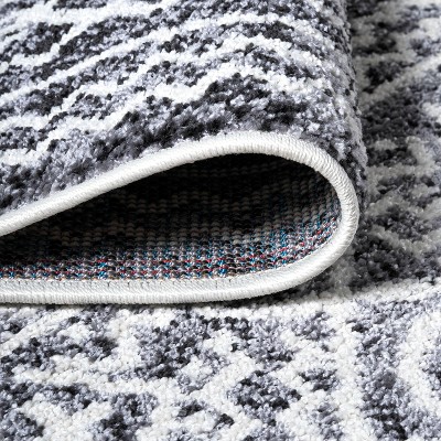 Ivory and Black Geometric Synthetic 8' x 10' Area Rug