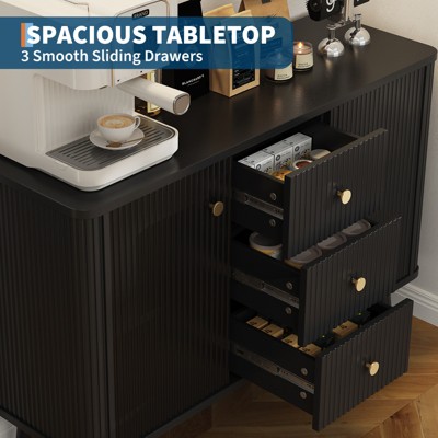 Open drawers of sideboard showing organization and storage compartments
