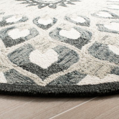 Handmade Charcoal and Ivory Wool 6' Round Tufted Area Rug