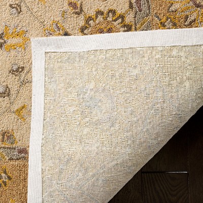 Ivory and Beige Rectangular Synthetic 6' x 9' Area Rug