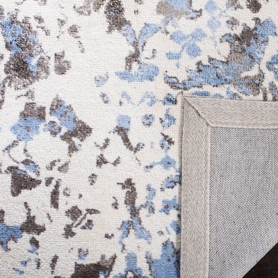 Ivory and Blue Tufted Handmade Wool and Viscose 6' x 9' Area Rug