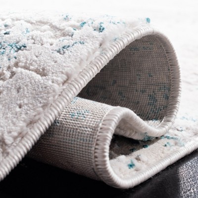Cream and Turquoise Abstract Wool and Synthetic Area Rug, 3' x 5'