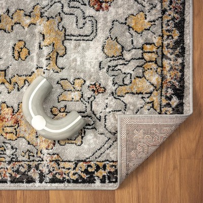 Distressed Orange and Beige Floral 6' x 9' Synthetic Area Rug