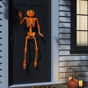 24" Poseable Pumpkin Head Skeleton Halloween Decorative Prop Orange - Hyde and EEK! Boutique™ - 1 of 3