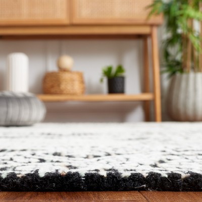Handmade Black Wool 6' x 9' Tufted Area Rug