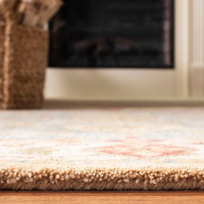 Ivory and Blue Hand Tufted Wool 4' x 6' Area Rug