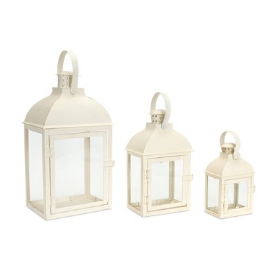 HomeRoots Set of Three Ivory Distressed Glass And Metal Floor Lantern Candle Holders