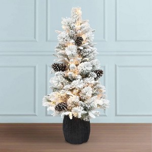 Puleo 4.5' Pre-lit Flocked Potted Artificial Christmas Tree with Clear Lights and Faux Rattan Base: Indoor PVC Decor - 1 of 3