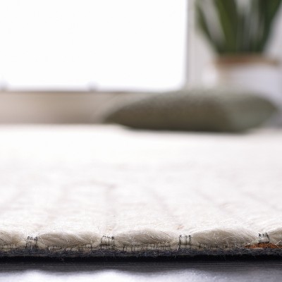 Ivory and Brown 6' x 9' Flat Woven Wool Area Rug