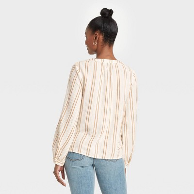 cream colored peasant blouse