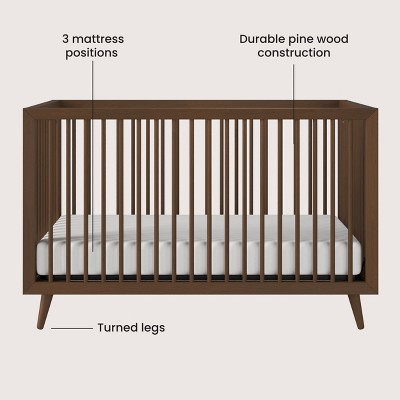 Diagram highlighting three mattress positions, durable pine wood construction, and turned legs.