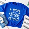 Simply Sage Market A Mom Who Runs On Caffeine And Kisses Sweatshirt - 3 of 4