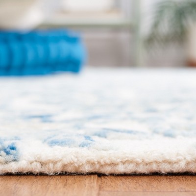 Ivory and Blue Floral Hand-Tufted Wool Area Rug 4' x 6'