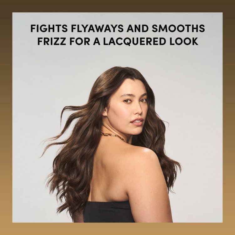 A person with long, smooth, brown hair is shown with text above reading "Fights flyaways and smooths frizz for a lacquered look."