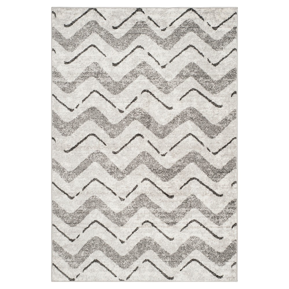 5'1 x7'6  Briarwood Adirondack Area Rug Silver/Charcoal - Safavieh Inspired by global travel, the bold colorful motifs and alluring patterns, Briarwood Adirondack Area Rugs translate rustic lodge style into supremely chic, easy-care floor coverings. Made using enhanced polypropylene yarns, Briarwood rugs explore stylish over-dye and antiqued looks, making a striking fashion statement in any room. Safavieh translates rustic lodge style into the supremely chic and easy-care collection. The Briarwood Collection is power loomed using soft yet durable enhanced polypropylene yarns for a comforting feel underfoot and lasting beauty.   Size: 5'1 X7'6 . Color: One Color. Pattern: Chevron.