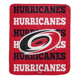 NHL Carolina Hurricanes Repeat Logo Wordmark Ultra Soft Blanket - 1 of 1