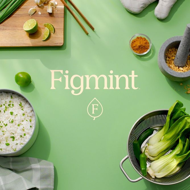 The word Figmint is surrounded by fresh ingredients, pots & pans, and other cookware supplies.