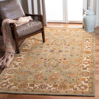 Handmade Ivory and Green Wool Tufted Oval Area Rug 4' x 6'