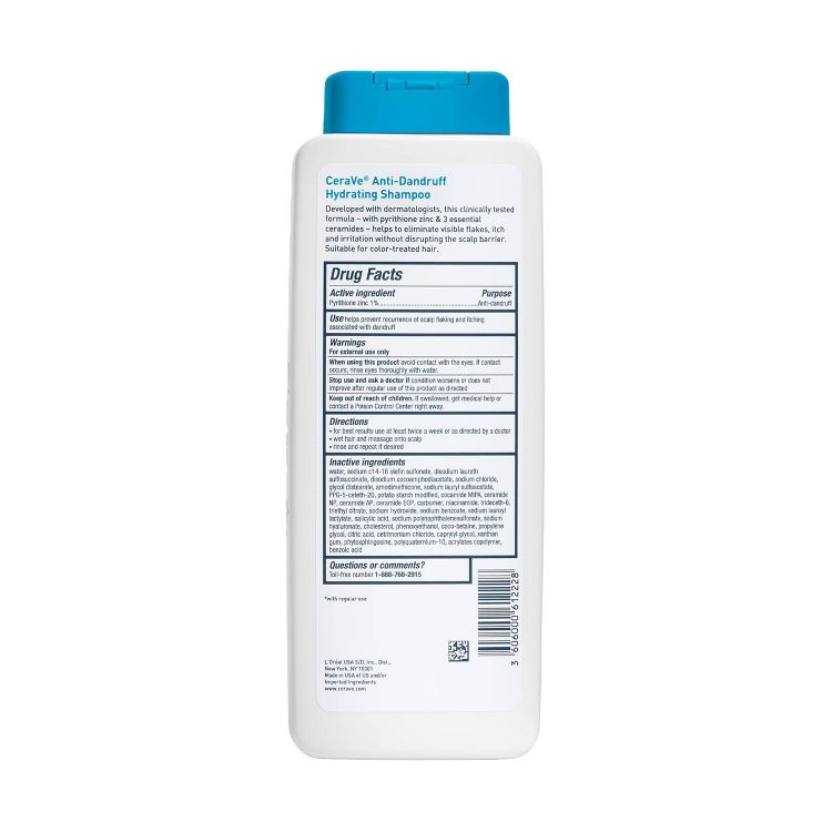 White bottle of CeraVe Anti-Dandruff Hydrating Shampoo with a blue cap, displaying drug facts and ingredients on the back label.