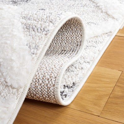 Ivory and Beige Diamond Shag Synthetic Area Rug with Braided Fringe
