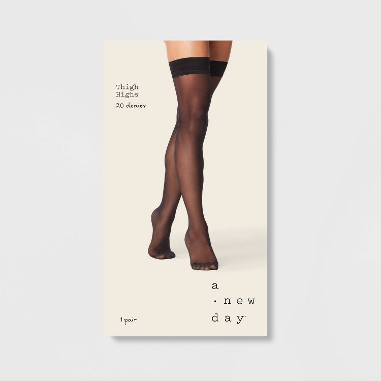 Black colored thigh-high hosiery with a 20 denier label.