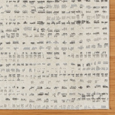 Ivory and Gray Tufted Polka Dot 5' x 7' Synthetic Rug