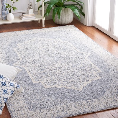 Ivory and Blue Handmade Wool Tufted 6' x 9' Abstract Rug