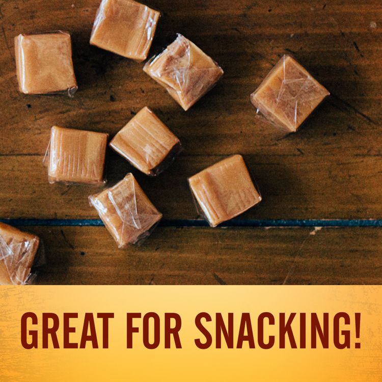 Wrapped caramel colored candies scattered on a wooden surface with the text "GREAT FOR SNACKING!" below.
