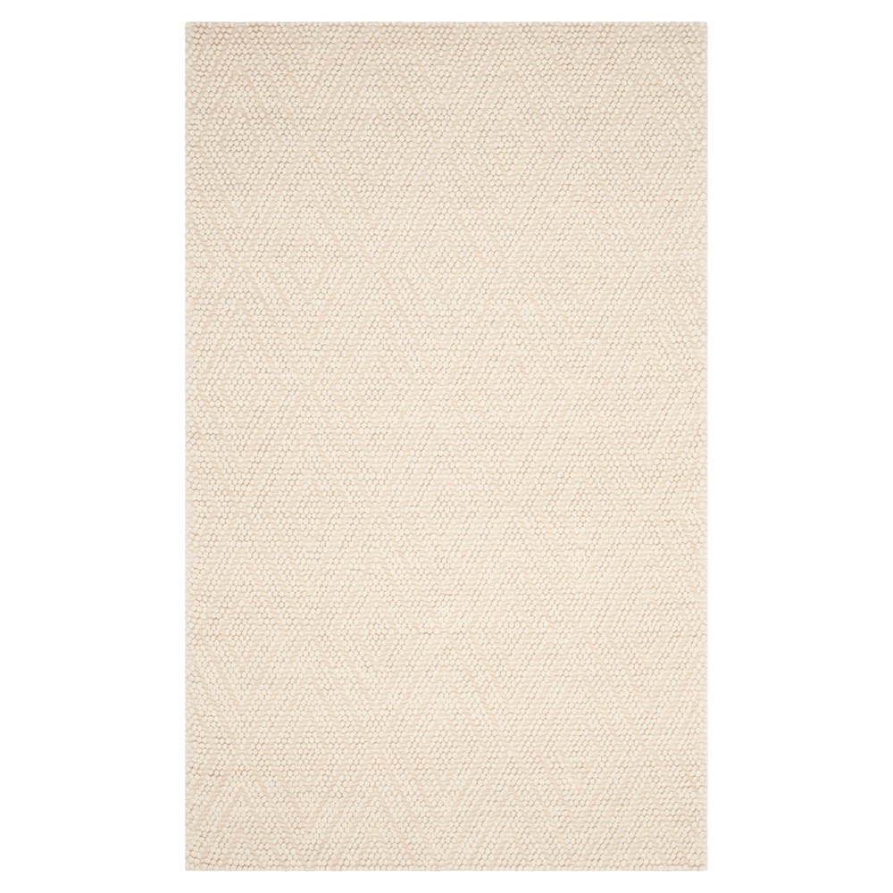 Ivory Solid Tufted Area Rug - (5'x8') - Safavieh