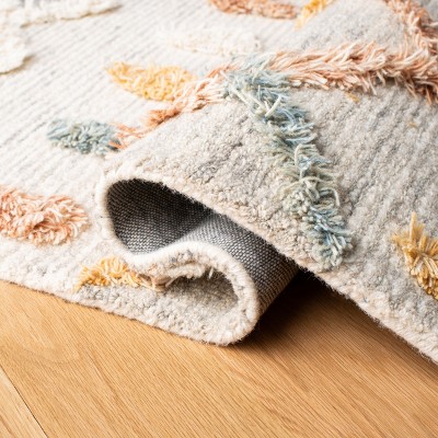 Handmade Ivory Wool Rectangular 6' x 9' Rug