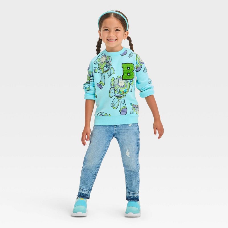 Toddler Girls' Disney Toy Story Buzz Fleece Pullover Sweatshirt - Blue, 3 of 6