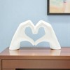 HomeRoots 4" White Resin Heart Hands Tabletop Sculpture - 2 of 4