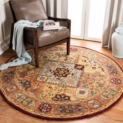 Handmade Round Red and Rust Wool Area Rug