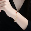 Guili 14K Gold-Plated Double Chain Bracelet with Red and White Beads Featuring an Open Heart Charm for a Romantic and Playful Look - 3 of 3