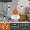 VAXCEL Orbit Brass and Oil Rubbed Bronze Industrial MCM Wall Sconce Light Clear Glass Globe - 2 of 4