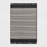 7' x 10' Outdoor Rug Striped Fringe Black - Project 62™