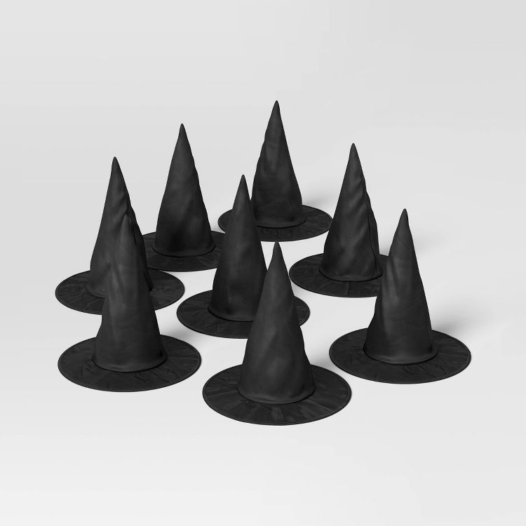Eight black colored witch hats arranged on a white surface.
