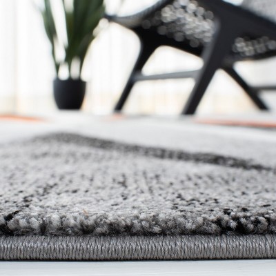 Gray and Orange Mid-Century Modern 4' x 6' Synthetic Area Rug