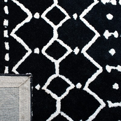 Black and Ivory 6' x 9' Tufted Wool Area Rug
