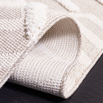 Ivory and Beige Geometric Synthetic 8' x 10' Area Rug