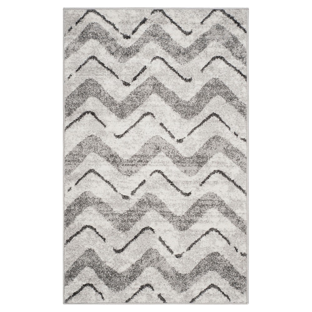 3'x5' Briarwood Adirondack Area Rug Silver/Charcoal - Safavieh Inspired by global travel, the bold colorful motifs and alluring patterns, Briarwood Adirondack Area Rugs translate rustic lodge style into supremely chic, easy-care floor coverings. Made using enhanced polypropylene yarns, Briarwood rugs explore stylish over-dye and antiqued looks, making a striking fashion statement in any room. Safavieh translates rustic lodge style into the supremely chic and easy-care collection. The Briarwood Collection is power loomed using soft yet durable enhanced polypropylene yarns for a comforting feel underfoot and lasting beauty.   Size: 3'X5'. Color: One Color. Pattern: Chevron.