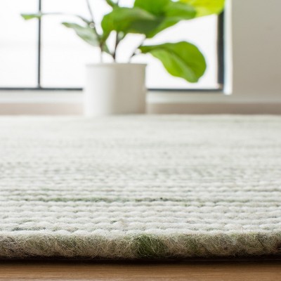 Ivory and Green Oval Braided Wool 4' x 6' Area Rug