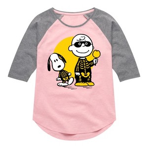 Girls' - Peanuts - Charlie And Snoopy Skeleton Shirt Tail Raglan Graphic T-shirt - 1 of 4