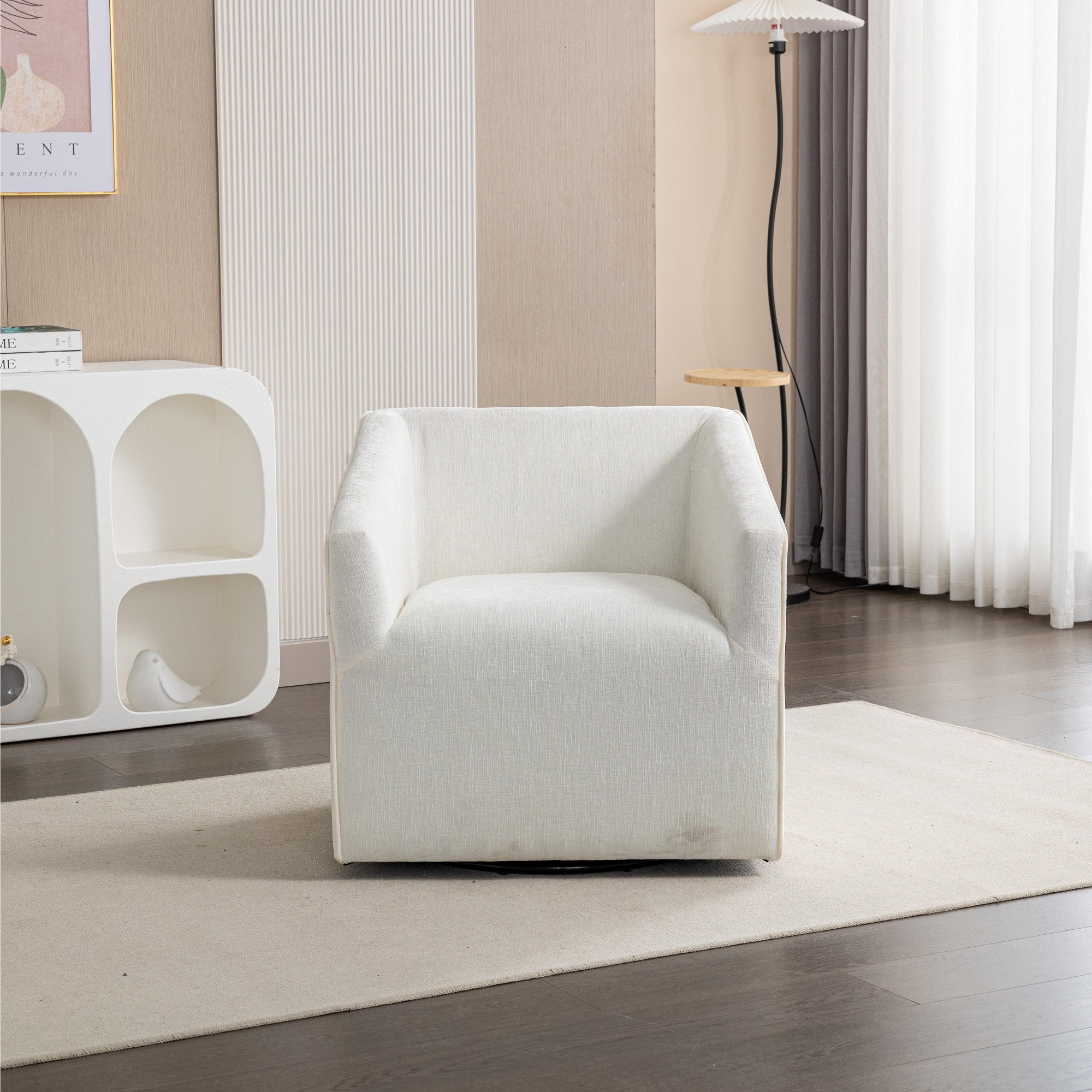White upholstered barrel armchair with rolled arms and swivel base.