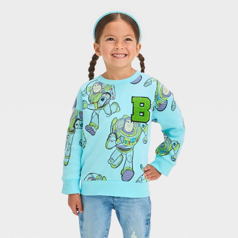 Toddler Girls' Disney Toy Story Buzz Fleece Pullover Sweatshirt - Blue, 1 of 6