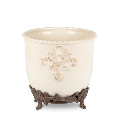 GG Collection Cream Stoneware Planter on Metal Acanthus Leaf Base.