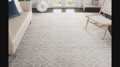 Navy and Cream Synthetic Bohemian Area Rug with Border Embellishment